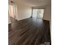 Bright living room with stylish floors and sliding glass doors to the outside at 338 Orchard Trace Ln # 8, Charlotte, NC 28213