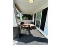Cozy front porch area with comfortable seating and stylish black shutters at 512 S Gray St, Gastonia, NC 28052
