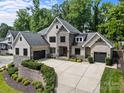 Stunning brick home boasts a spacious driveway and attached two-car garage at 5638 Timber Ln, Charlotte, NC 28270