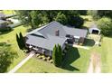 An aerial view of the charming brick home with a large, green yard, nice landscaping, and detached garage at 628 Stamie Dr, Chester, SC 29706