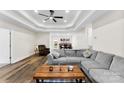 A spacious living room boasting a tray ceiling, hardwood floors, and comfortable seating at 7144 Marlin St, Gastonia, NC 28056