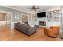 Elegant living room features a cozy fireplace, built-in bookshelves, and hardwood floors at 905 Mangionne Dr, Matthews, NC 28105