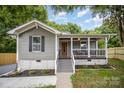 Charming bungalow-style home featuring a cozy front porch and freshly landscaped front yard at 952 Salisbury St, Wadesboro, NC 28170