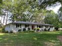Inviting home with a red door and manicured landscaping at 103 Boyd Dr, Stanley, NC 28164