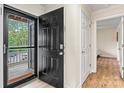 A warm and inviting entryway with hardwood flooring and a neutral color scheme at 1038 Southwest Dr, Davidson, NC 28036