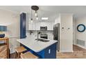 Modern kitchen with stainless steel appliances, marble countertops, and stylish pendant lighting at 1038 Southwest Dr, Davidson, NC 28036