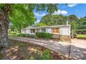 View of the front exterior of the home showcasing the charming white siding and lovely curb appeal at 1532 Buffalo Shoals Rd, Claremont, NC 28610