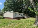 Charming single story home with black shutters and wooden front porch at 1555 Moore Rd, York, SC 29745