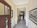 Bright foyer with wood floors and decorative wainscoting at 177 Yellow Birch Loop, Mooresville, NC 28117
