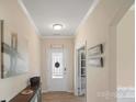 Bright foyer featuring wood floors, neutral walls, and decorative art at 2009 Trindle Vine Ln, Waxhaw, NC 28173