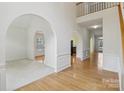 Open living space with archways, hardwood floors, and neutral tones offering a versatile layout at 2321 Oberwood Dr, Charlotte, NC 28270