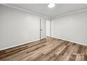Clean bedroom with new wood flooring and fresh paint at 3133 Amay James Ave, Charlotte, NC 28208