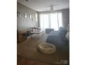 Cozy living room with soft, neutral tones, offering a relaxing atmosphere for unwinding and comfort at 3944 Town Center Rd, Harrisburg, NC 28075