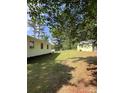 View of the backyard with green shed at 418 Cedar Grove Rd, Clover, SC 29710