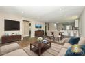 Inviting open-concept living area with wood floors, recessed lights and modern furnishings at 446 Mint St, Rock Hill, SC 29730