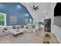 Open-concept living room and kitchen with stylish furnishings and vaulted ceilings at 516 North Mulberry St, Cherryville, NC 28021