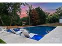 Beautiful swimming pool with in-pool lounge chairs at 6505 Folger Dr, Charlotte, NC 28270