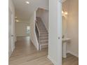 Open entryway features a stairway and half bath with pedestal sink at 1272 Langston Ln, Salisbury, NC 28144