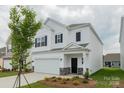 Inviting two-story home with a manicured lawn, and mature shade tree at 1272 Langston Ln, Salisbury, NC 28144