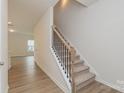 Bright stairway leads to the upper level, highlighting the home's layout at 1272 Langston Ln, Salisbury, NC 28144