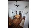 Bright living room boasting hardwood floors, a fireplace, and built-in bookshelves at 13409 Planters Row Dr, Charlotte, NC 28278