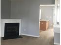 Inviting living room featuring a cozy fireplace and neutral paint, offering a warm atmosphere at 136 Mangum Cir, Mooresville, NC 28117
