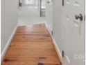 Hallway features beautiful hardwood floors, adding warmth and character to the home at 2308 Blair House Ct, Charlotte, NC 28270