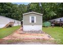Charming single story home featuring manicured lawn and mature trees in a quiet neighborhood at 251 Birch Tree Rd, Clover, SC 29710