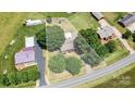 Aerial view of property showcasing home, mature trees, and lot boundaries at 3372 Lee Lawing Rd, Lincolnton, NC 28092