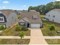 Charming home featuring a two-car garage and manicured lawn in a well-maintained neighborhood at 4427 Poplin Grove Dr, Indian Trail, NC 28079