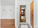 Inviting entryway with tiled floor and hardwood floors ahead at 7501 Glencannon Dr, Charlotte, NC 28227