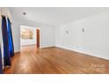 Spacious living room with hardwood floors, crown molding, and natural light at 7501 Glencannon Dr, Charlotte, NC 28227