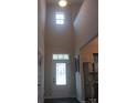 Bright foyer with high ceilings and a decorative glass front door at 858 Oak Manor Se Dr, Concord, NC 28025