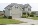 Well-maintained home with an attached garage and a neatly landscaped front yard at 858 Oak Manor Se Dr, Concord, NC 28025