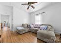 Inviting living room with hardwood floors, a comfortable sectional, and plenty of space at 1008 Valley St, Kannapolis, NC 28081