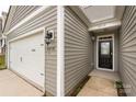 This charming home features a covered entryway and a spacious two-car garage at 10410 Bradstreet Commons Way, Charlotte, NC 28215