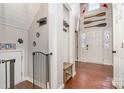 Inviting foyer featuring hardwood floors, coat rack, bench seating and decorative oars at 108 Shade Tree Cir, Fort Mill, SC 29715