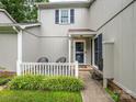 Charming townhome with a cozy front porch, a gray exterior and blue shutters at 11120 Sevilla Ct, Charlotte, NC 28226