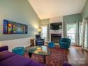 Inviting living room featuring a fireplace, ample seating, and an open layout at 11120 Sevilla Ct, Charlotte, NC 28226