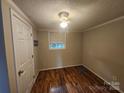 Bright bedroom with hardwood floors, a ceiling fan, and natural light from a window at 11550 Us Hwy 52 N Hwy, Ansonville, NC 28170