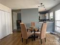 Dining room with hardwood floors and a glass table at 1177 Triece Ln, Charlotte, NC 28215