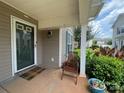 Inviting front porch with a chair and decorative potted plants at 1177 Triece Ln, Charlotte, NC 28215