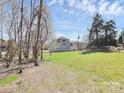 Spacious backyard showcasing a large grassy area and fencing at 12300 Caldwell Rd, Charlotte, NC 28213