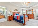 Spacious main bedroom with tray ceilings, carpet floors, and an en-suite bathroom at 1418 Skidaway Nw St # 427, Concord, NC 28027