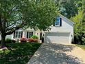 Charming two-story home with lush landscaping and a well-manicured lawn at 21218 Baltic Dr, Cornelius, NC 28031