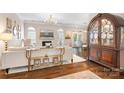 Elegant living room with hardwood floors, fireplace, and stylish furnishings at 21218 Baltic Dr, Cornelius, NC 28031