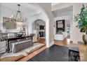 Open-concept with hardwood floors, arched entryways, and a fireplace at 394 Stonecliff Ln, Clover, SC 29710