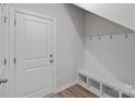 Mudroom with a storage bench, coat hooks, and a door to the garage at 4008 Yucca Aly, Charlotte, NC 28217