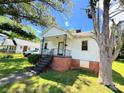 Quaint single-Gathering home with a covered front porch and mature shade trees at 450 1St Se St, Hickory, NC 28602