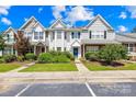 Inviting townhomes featuring lush landscaping, and ample parking enhancing community appeal at 6128 Warrior Ave, Fort Mill, SC 29707
